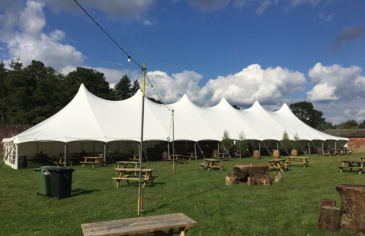 Traditional pole outlet marquee